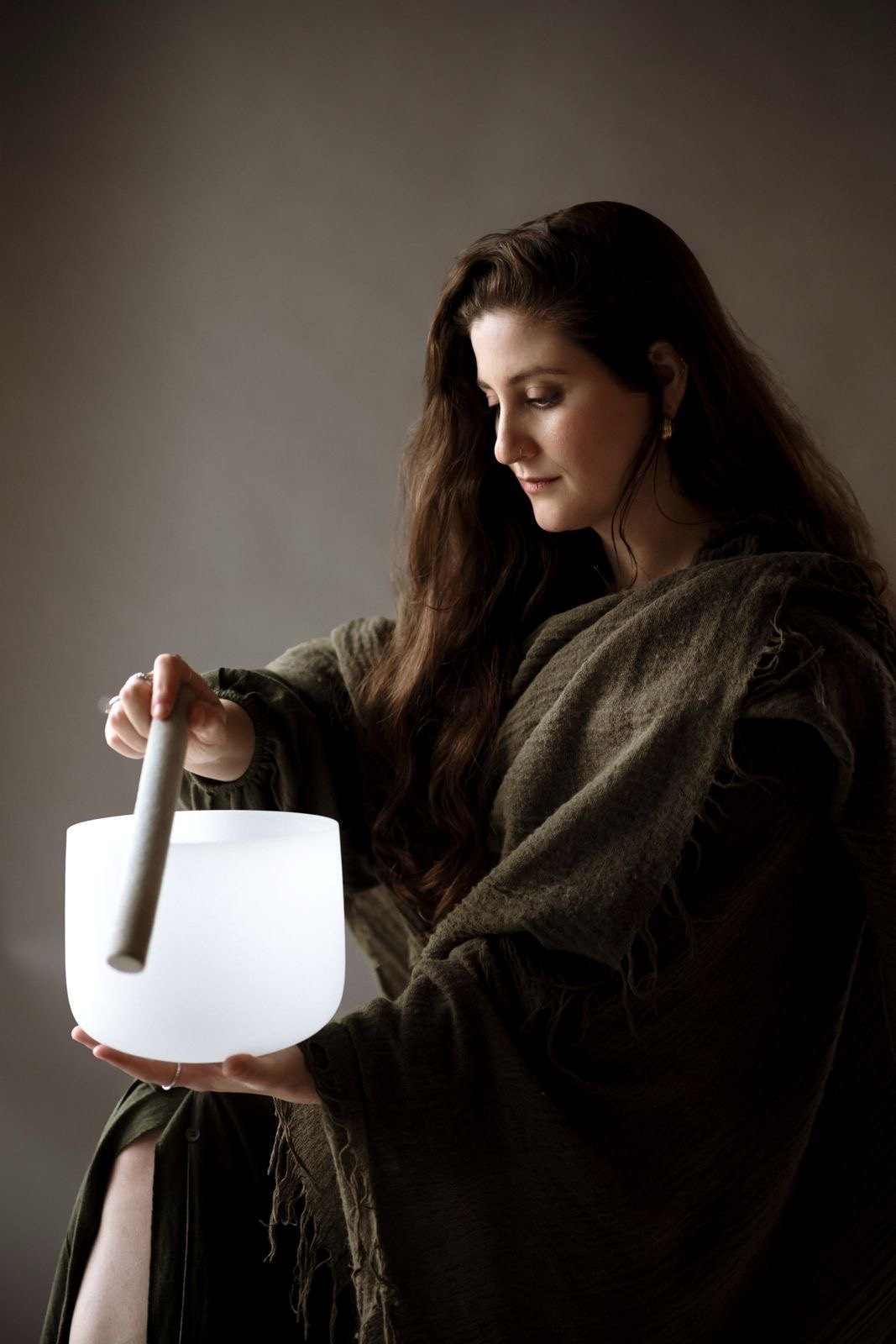 Tanya holding a crystal singing bowl